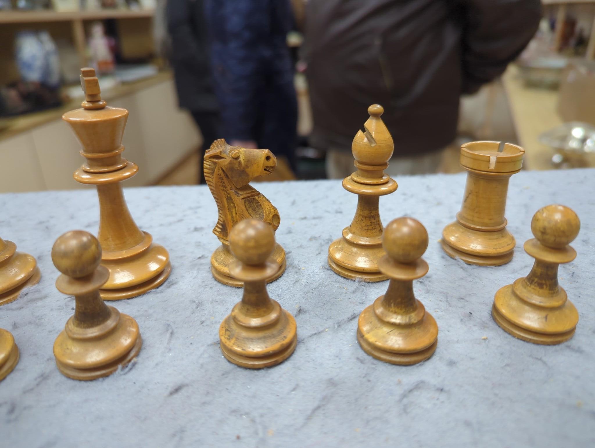 After Mene, a bronze greyhound, a Staunton-pattern chess set and a set of Victorian postal scales, bronze 22cms wide